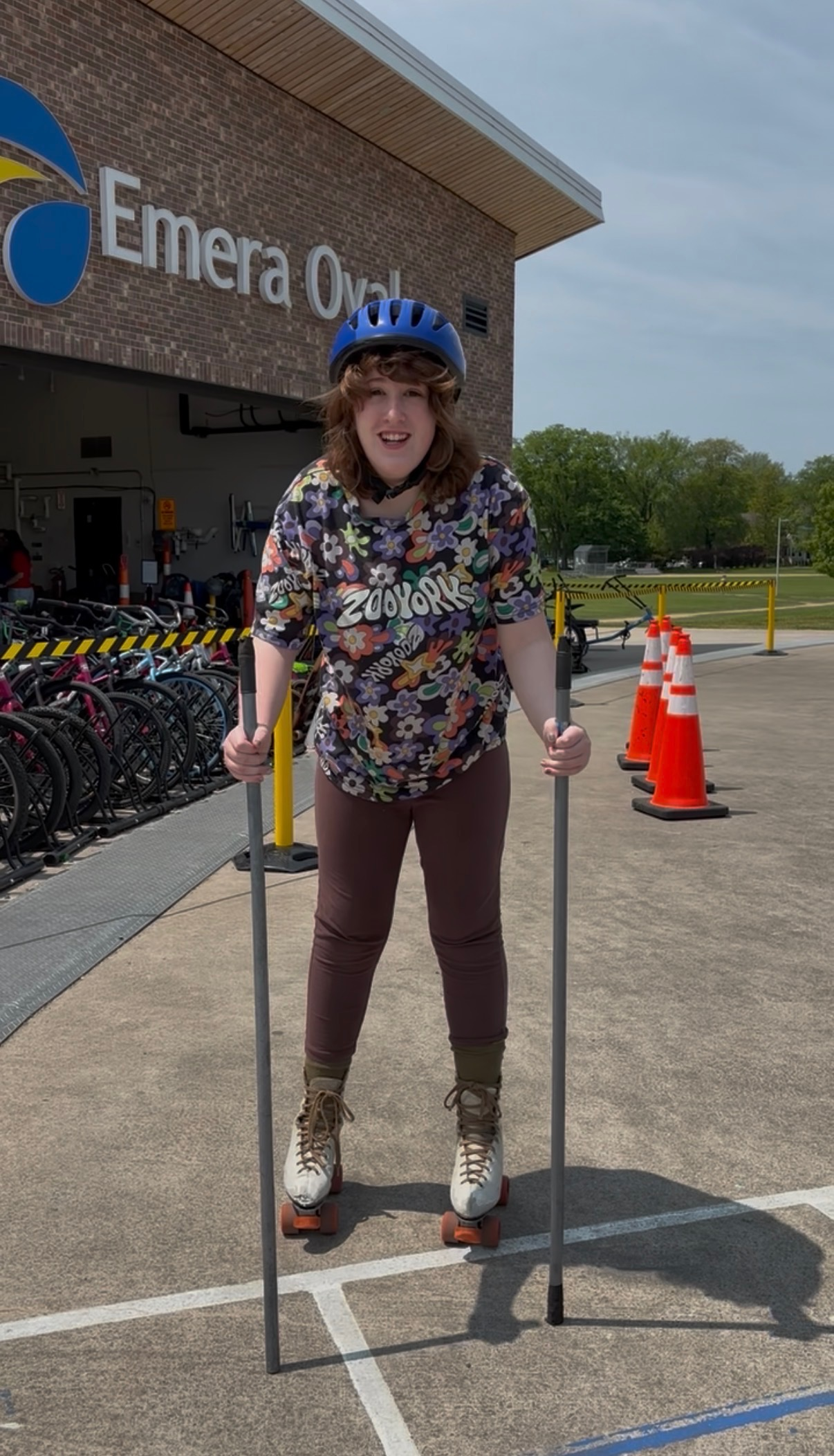 individual participates using hand poles and roller skates
