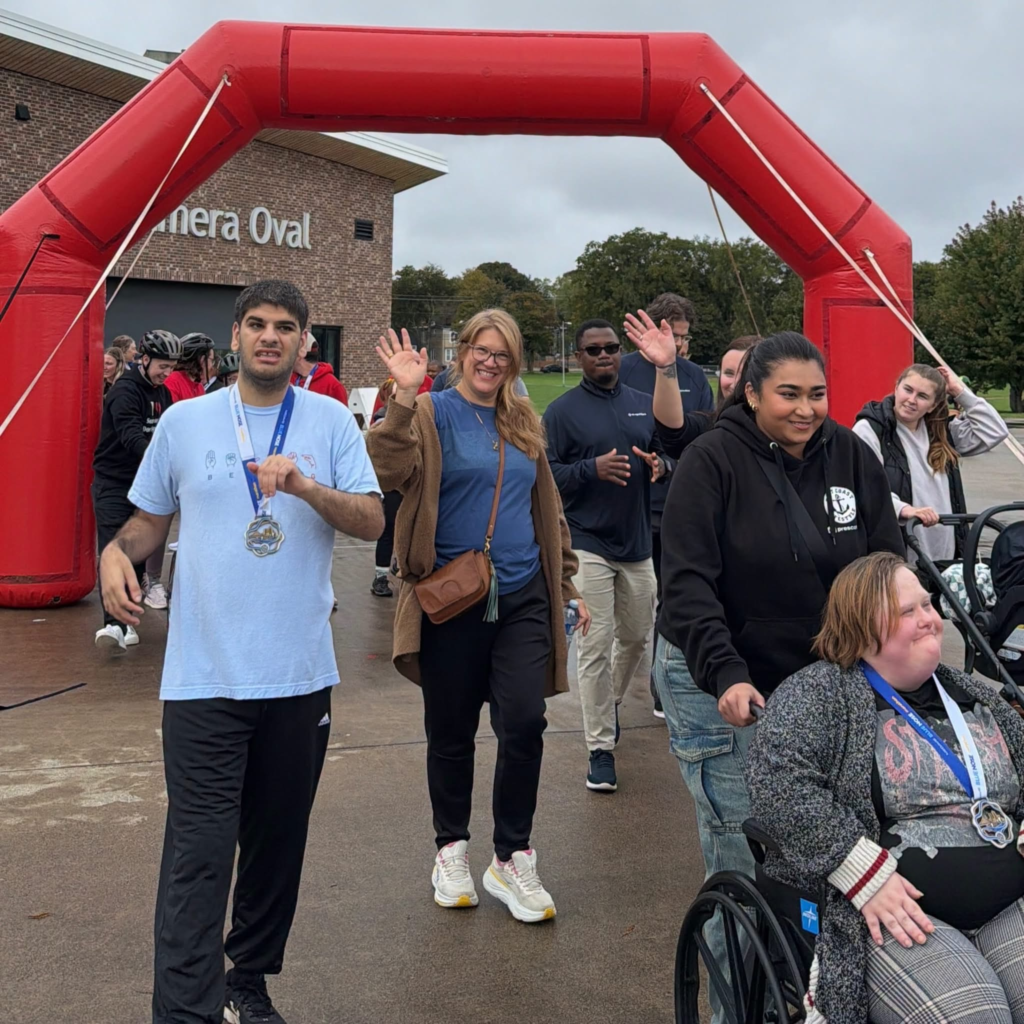 group participating in walkathon wave as they roll together around the course.